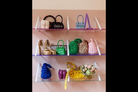 Bags and shoes on shelves in store at By Rotation, Belgravia